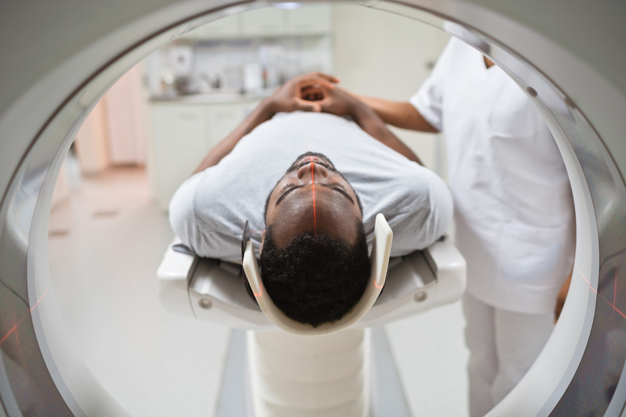 Man lying down and preparing to get an MRI