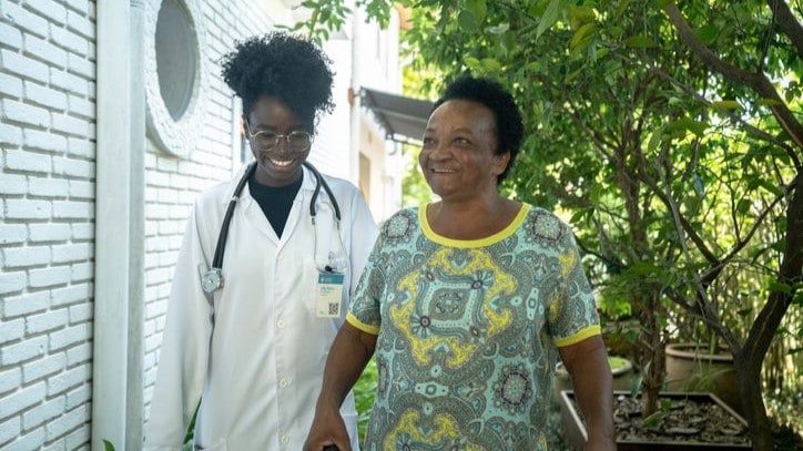 Doctor and patient walking outside.