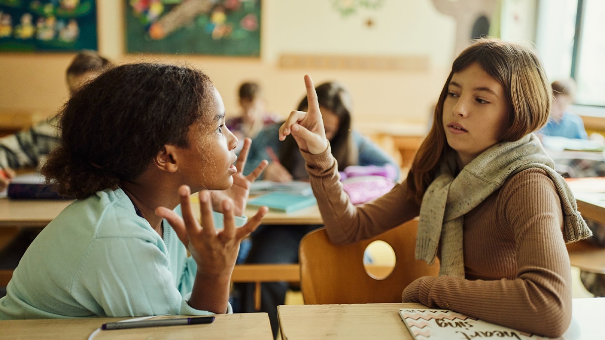 Two children arguing at school