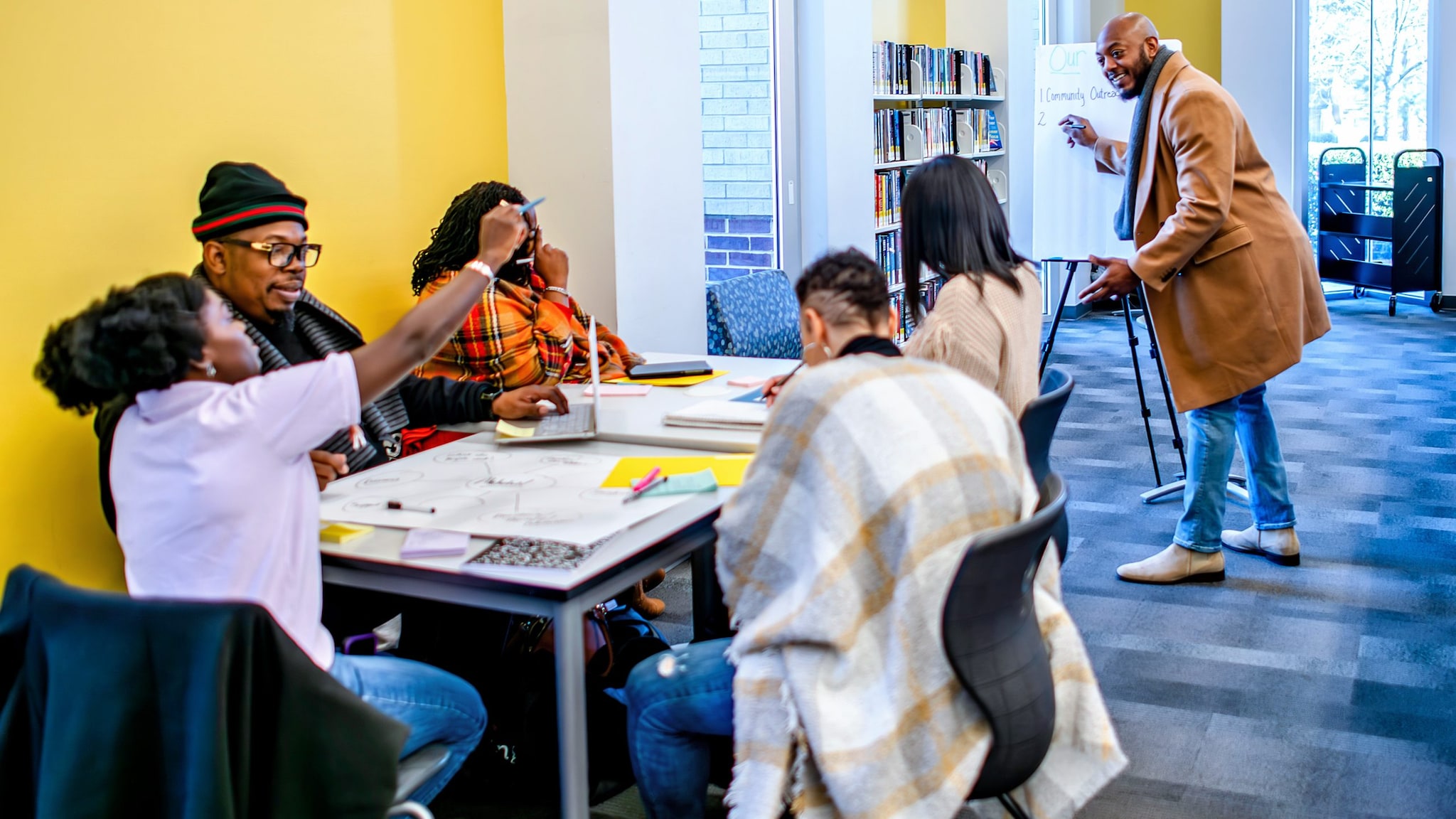 Community group is strategizing in a library.