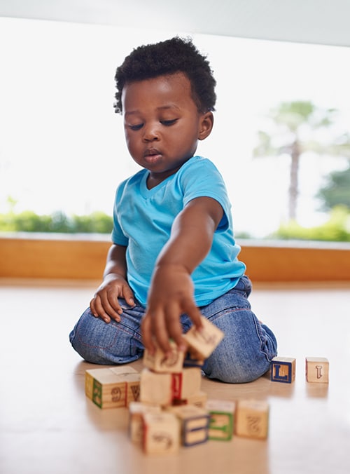 Young child playing with blocks