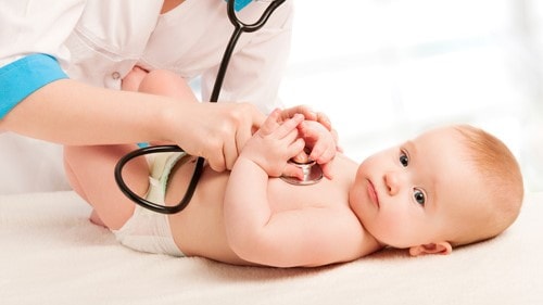 Doctor examining baby.