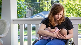 Breastfeeding mother in a wheelchair