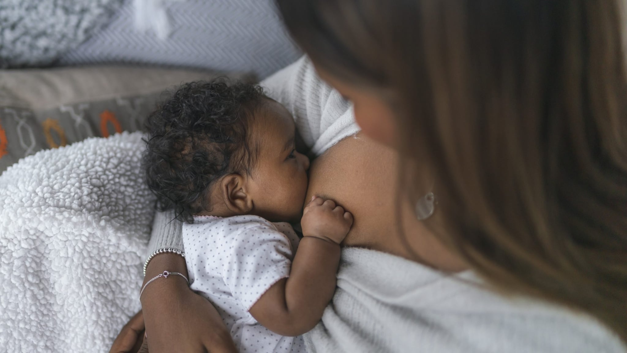 Woman breastfeeding a newborn.