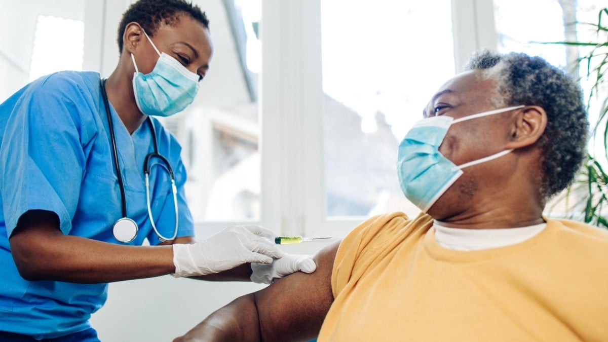 Photo of a doctor giving a flu shot