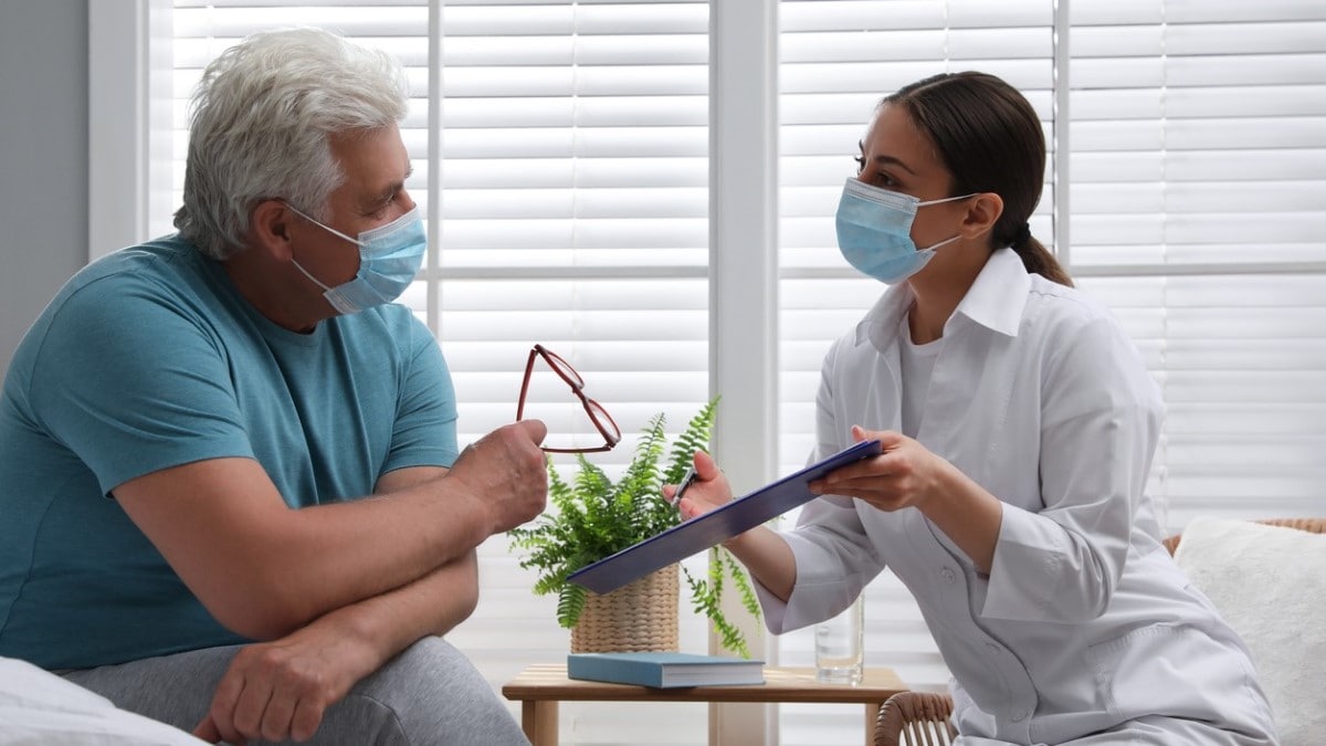 a nurse discussing a survivorship care plan with a patient