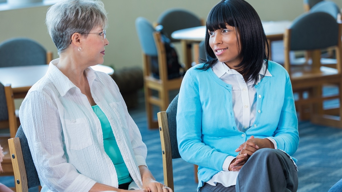 Photo of two women talking