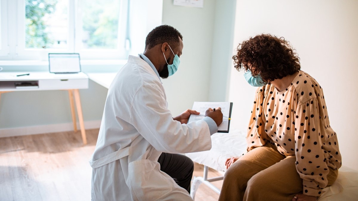 Woman speaking with her doctor.