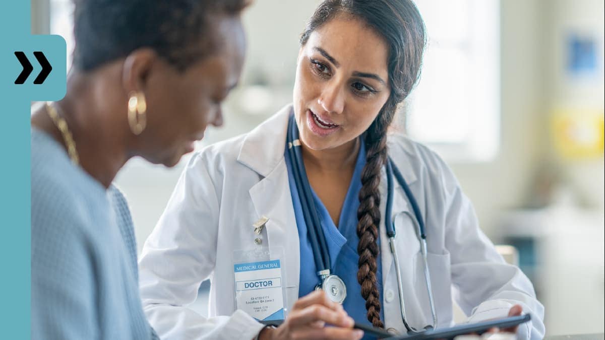 A doctor speaking to a patient