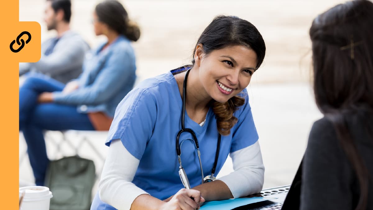 Nurse with a patient taking notes.