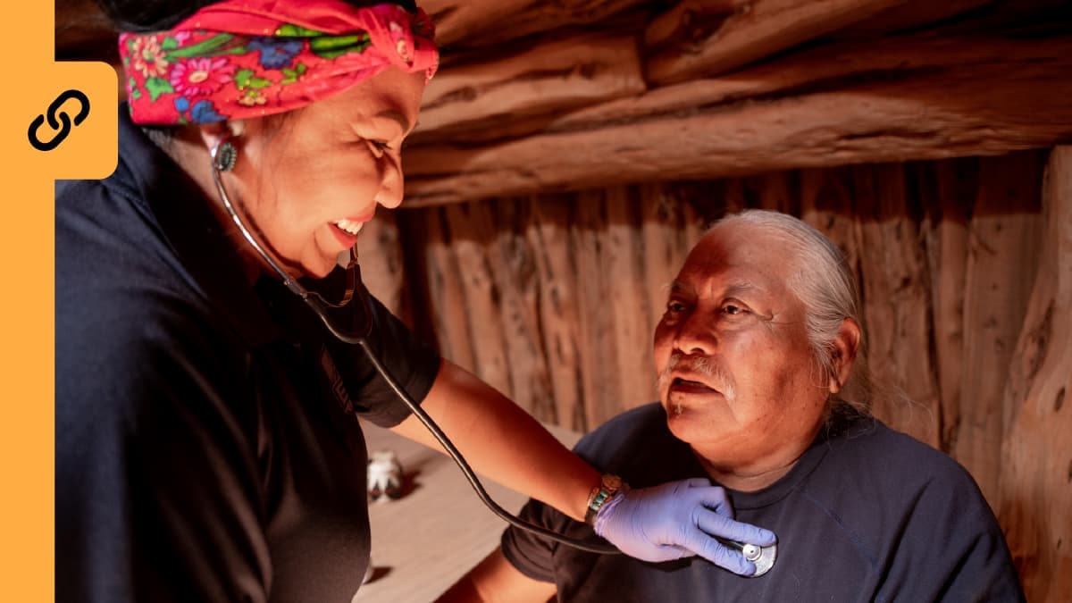 Photo of a nurse checking a patient's pulse