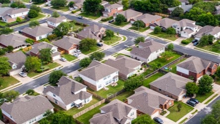 Aerial view of a neighborhood with many houses and trees.