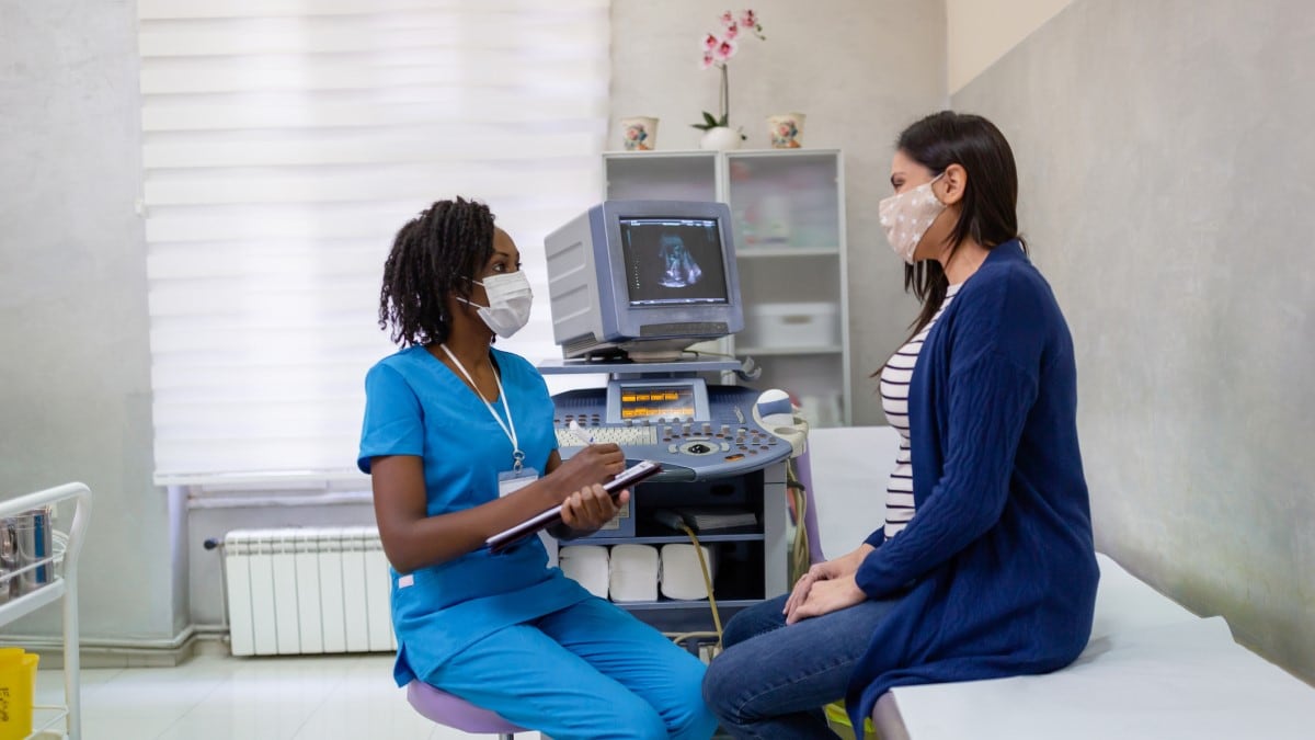 Photo of a woman talking to her doctor