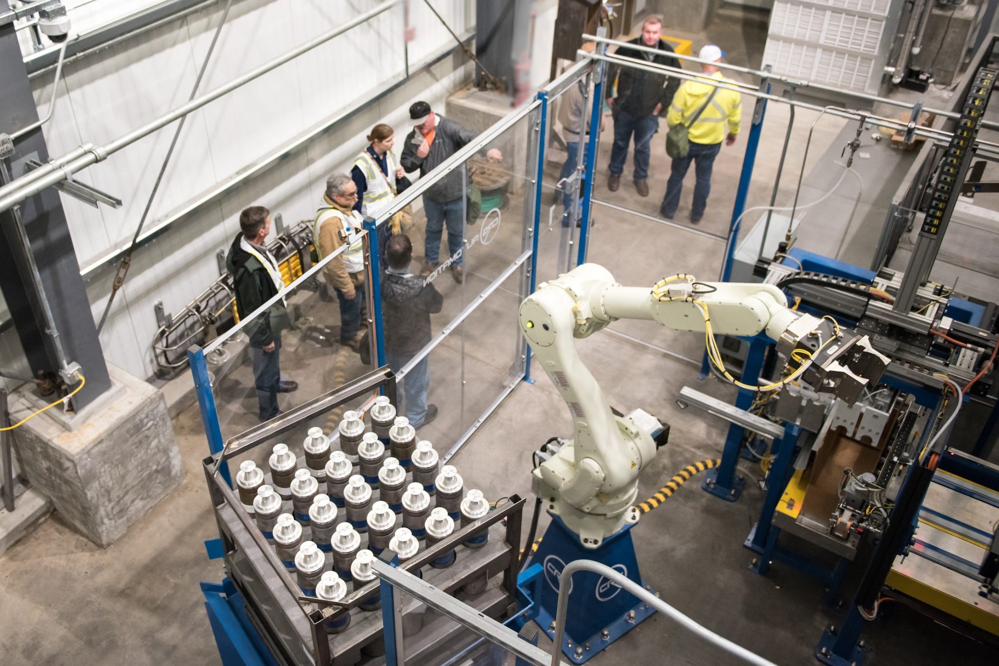 A group of inspectors in an industrial facility.