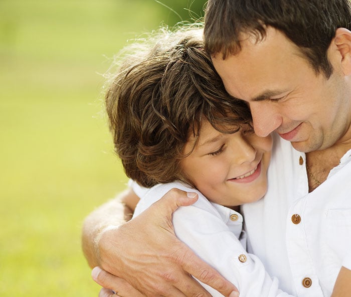 Father and son hugging