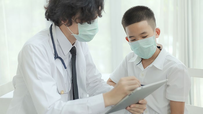 A doctor showing a young patient test results