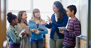 Teacher explaining lesson to students