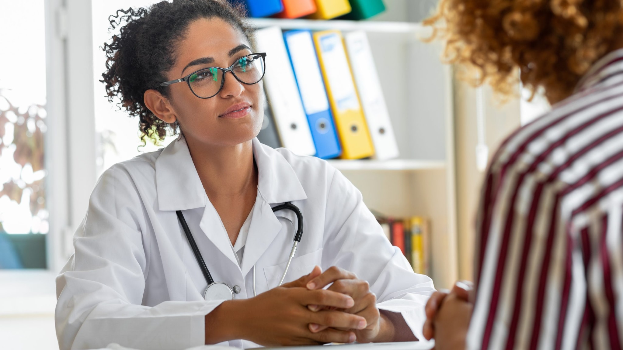 Healthcare provider listening to patient.