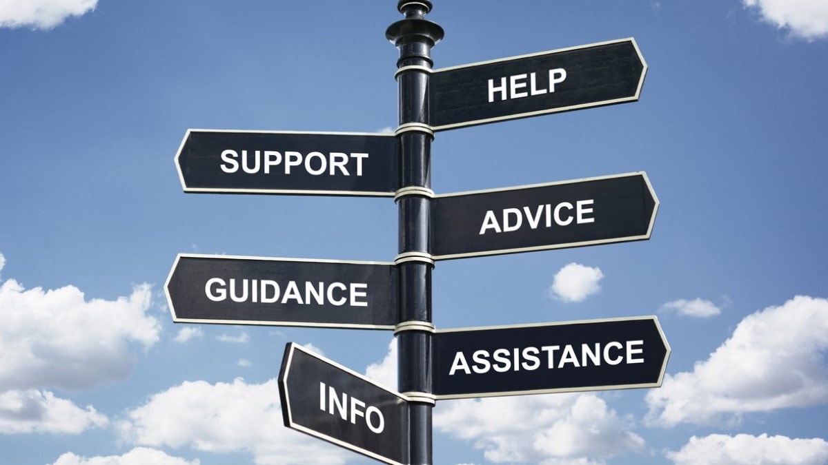 Help, support, advice, guidance, assistance and info crossroad signpost.