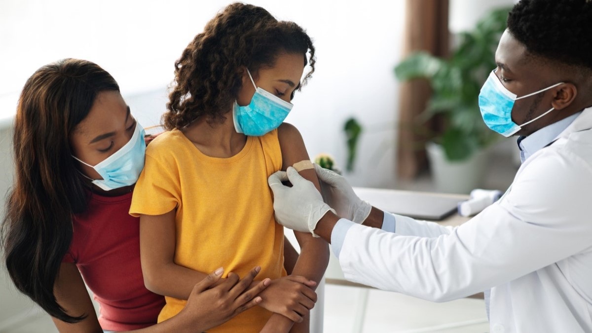 a doctor giving an HPV vaccine to a child