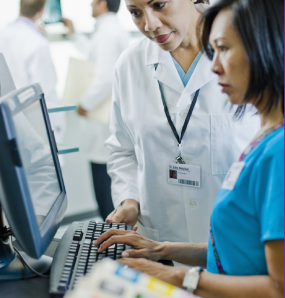 Doctor with Nurse at Computer