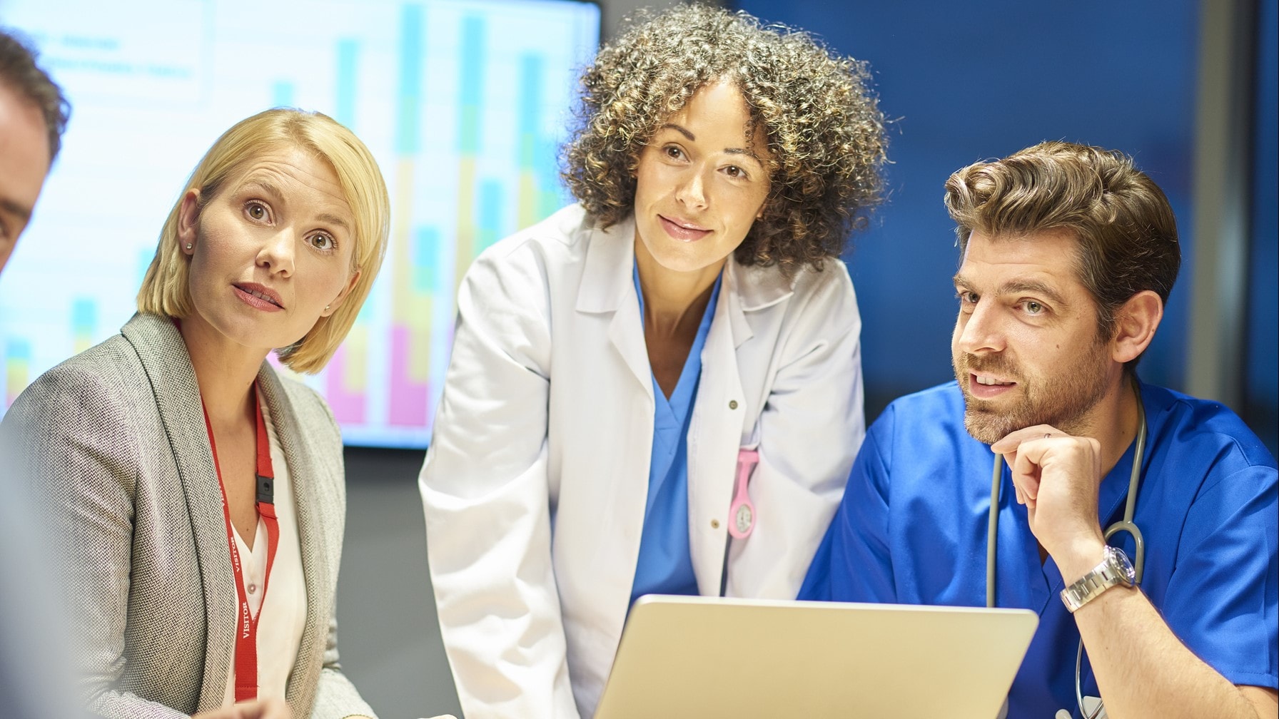 Group of health care partners having a discussion around a table