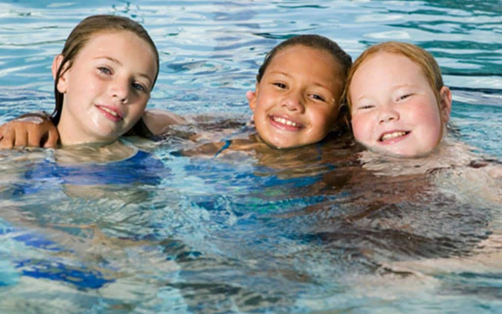 Kids playing at the Community Swim Club.