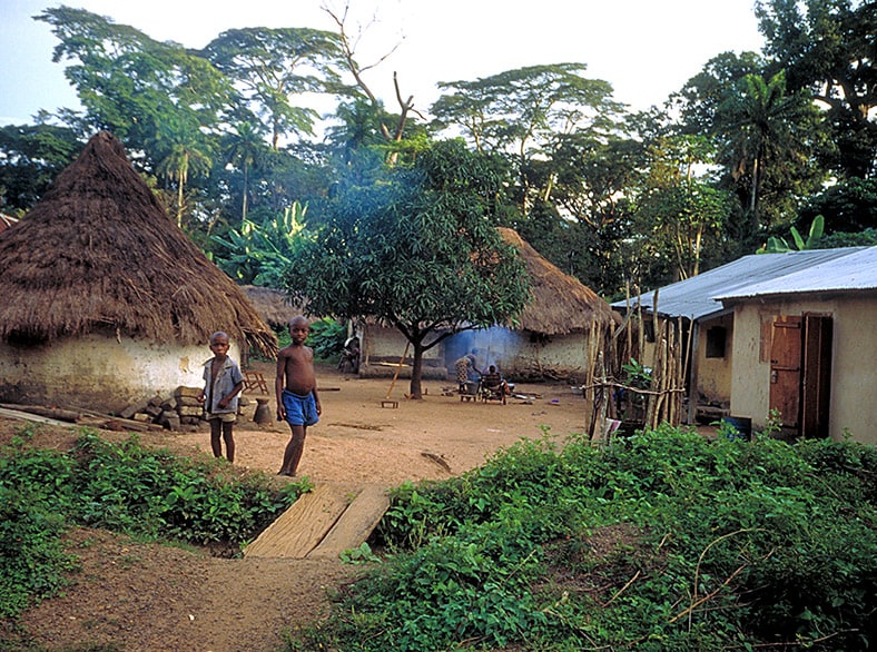 two boys standing in African village