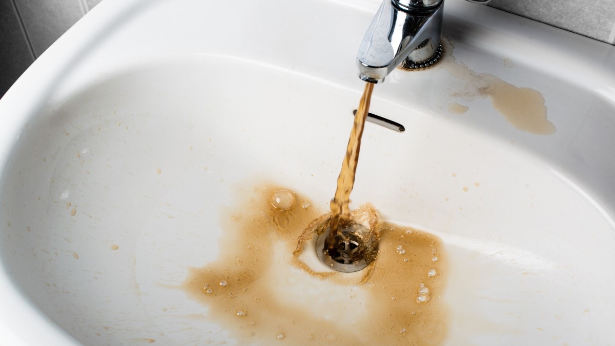 Brown water coming out of a sink faucet