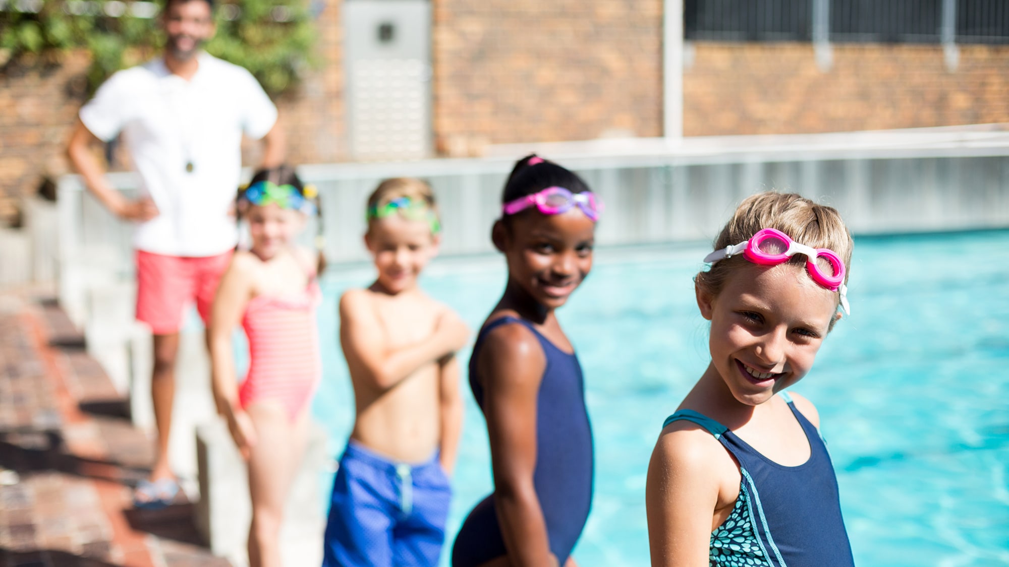 Kids at swim practice on a sunny day