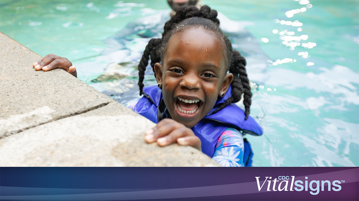 Girl in life jacket in pool with dad. CDC Vital Signs