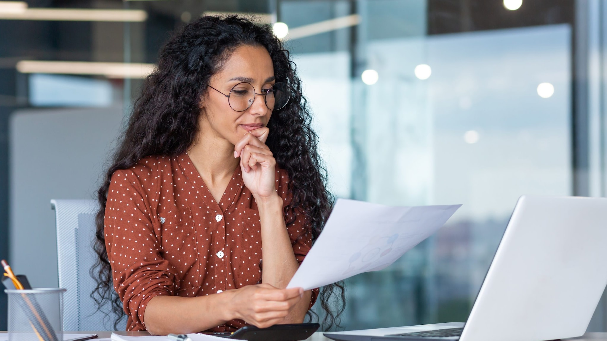 Woman works in front of her laptop