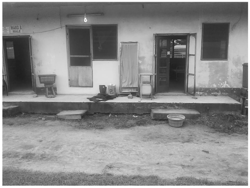 Emergency Ebola treatment center using an old hospital ward with improvised water, sanitation, and hygiene (WaSH) stations until a more suitable center could be set-up: Nigeria, 2014.