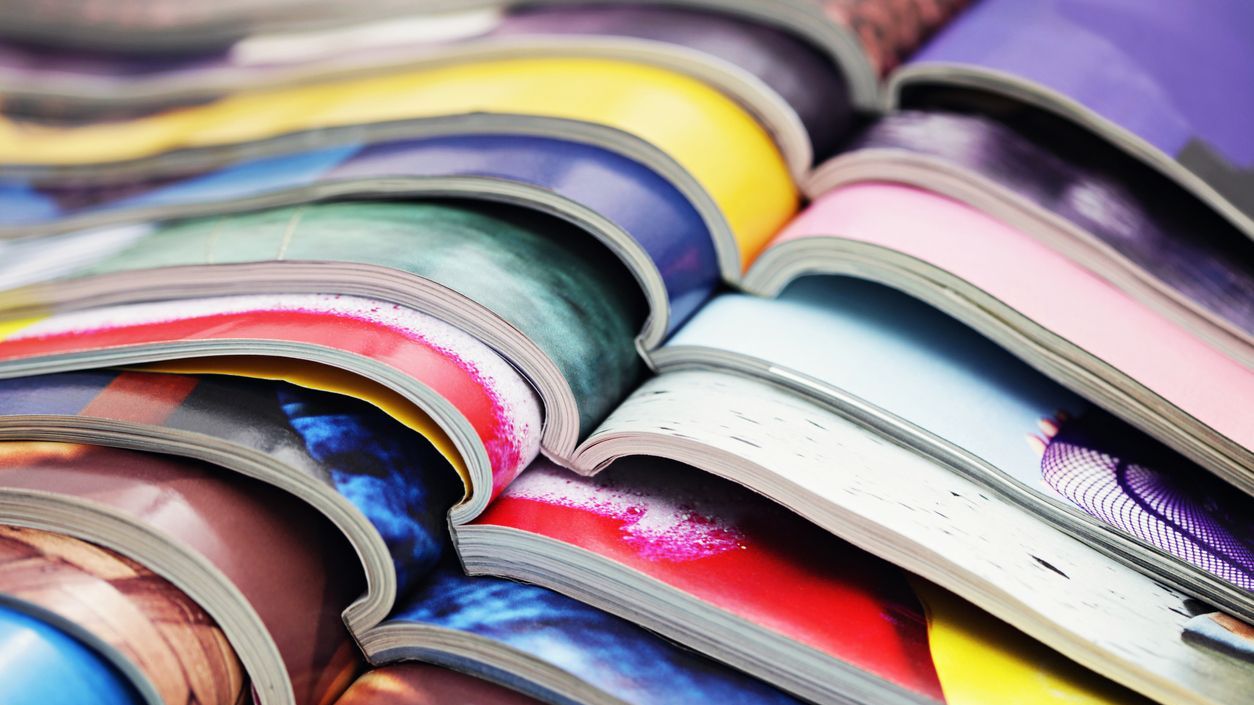 Stack of open journals.