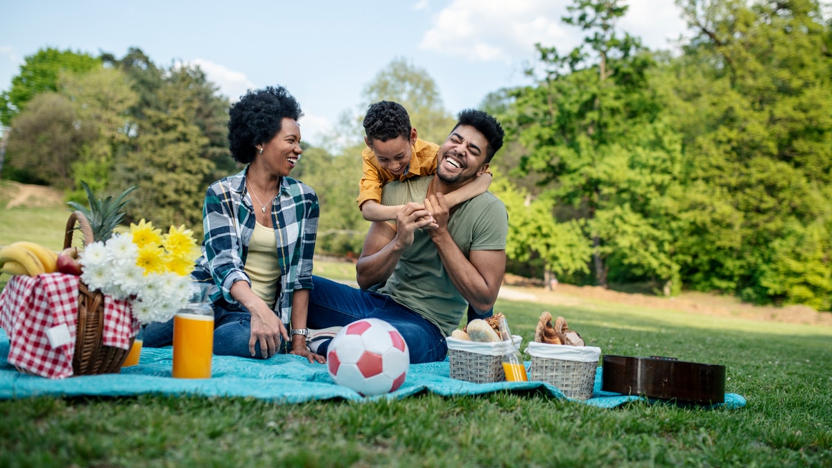 Family enjoying a picnic in a park.