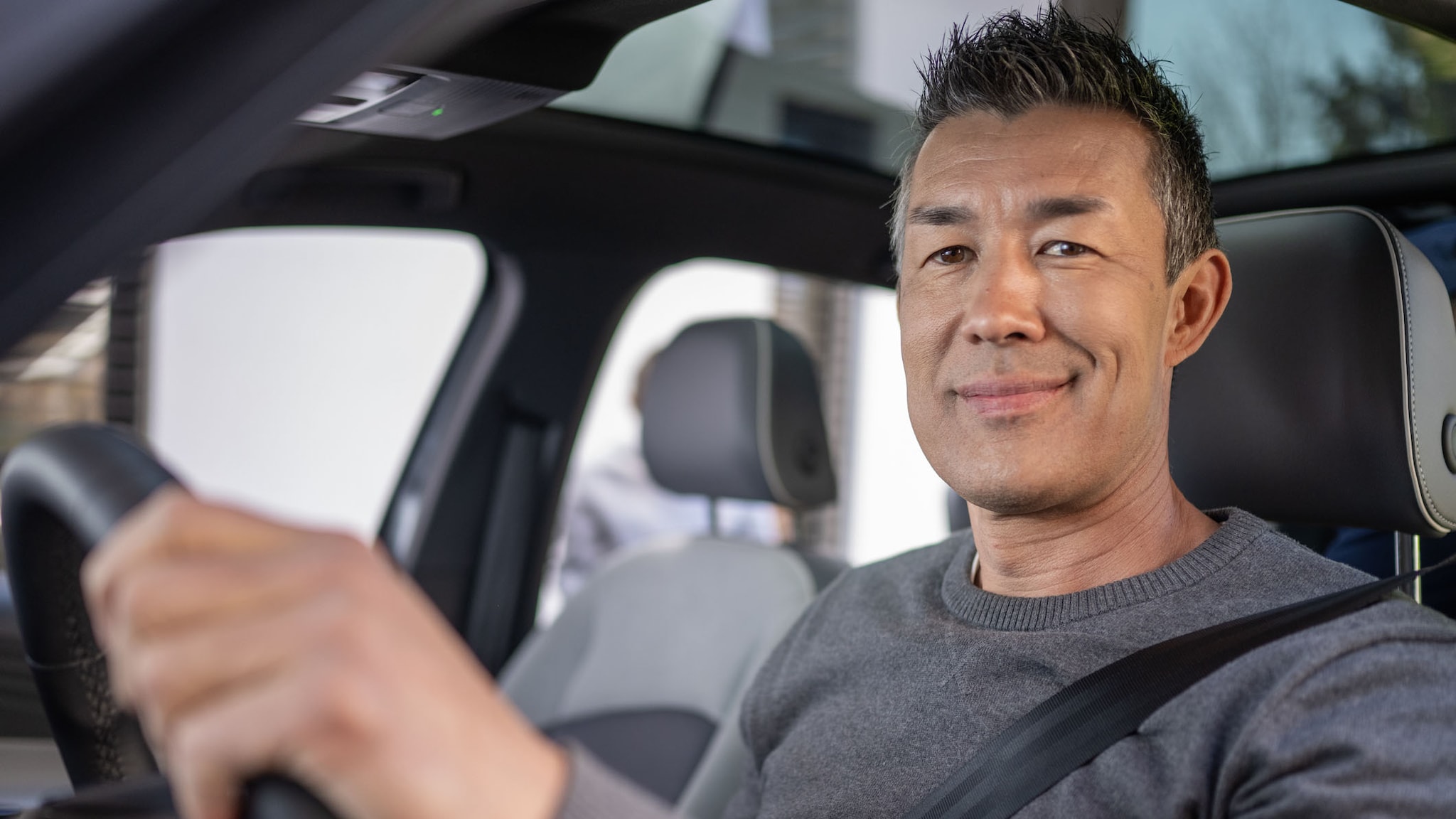 A man driving a car