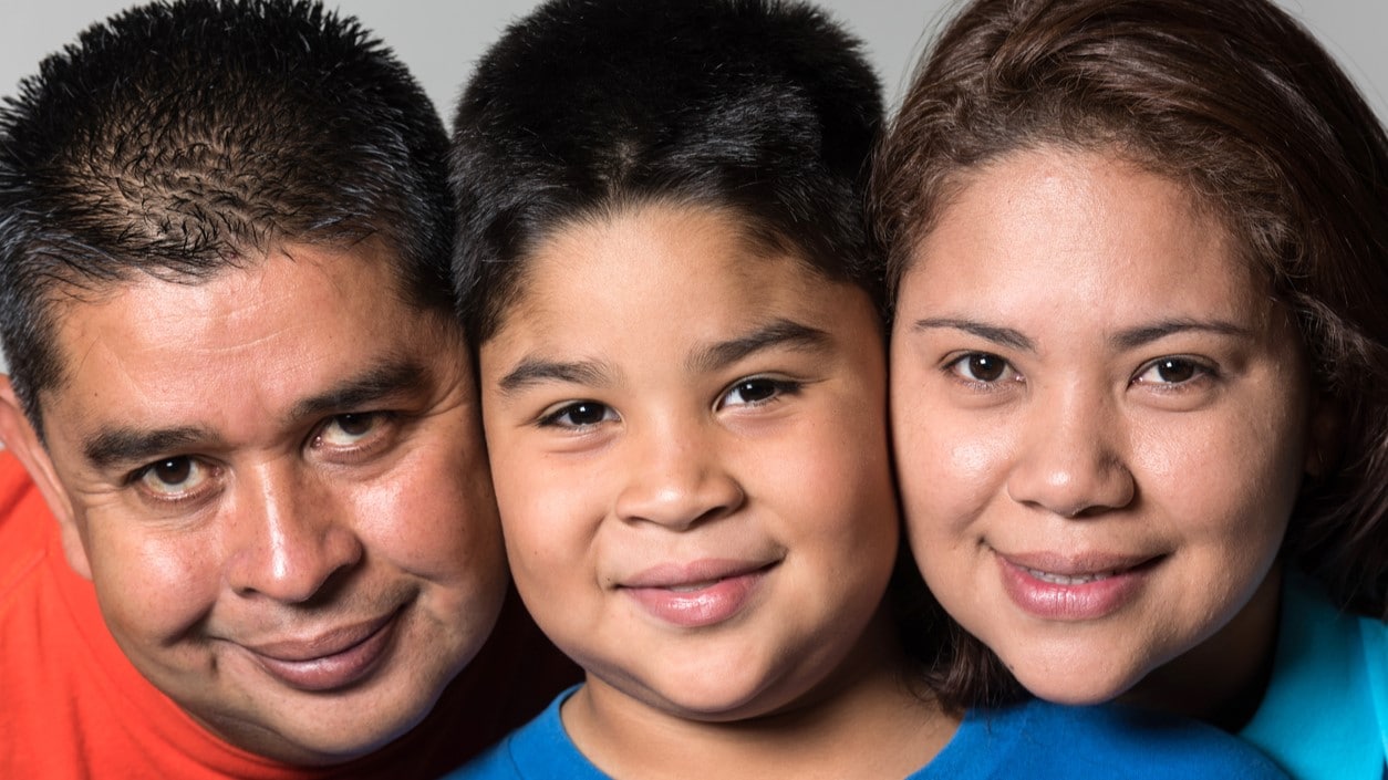 Close up of parents and child together.