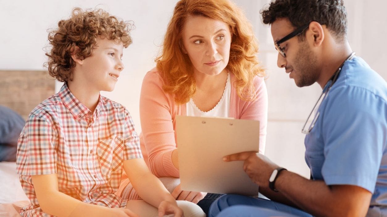 Doctor describing treatment options to parent and child