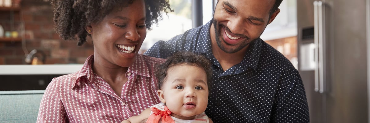 Mother and father with infant