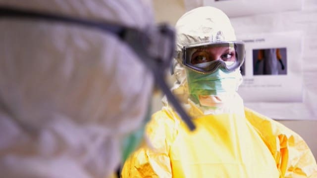 Woman wearing yellow PPE