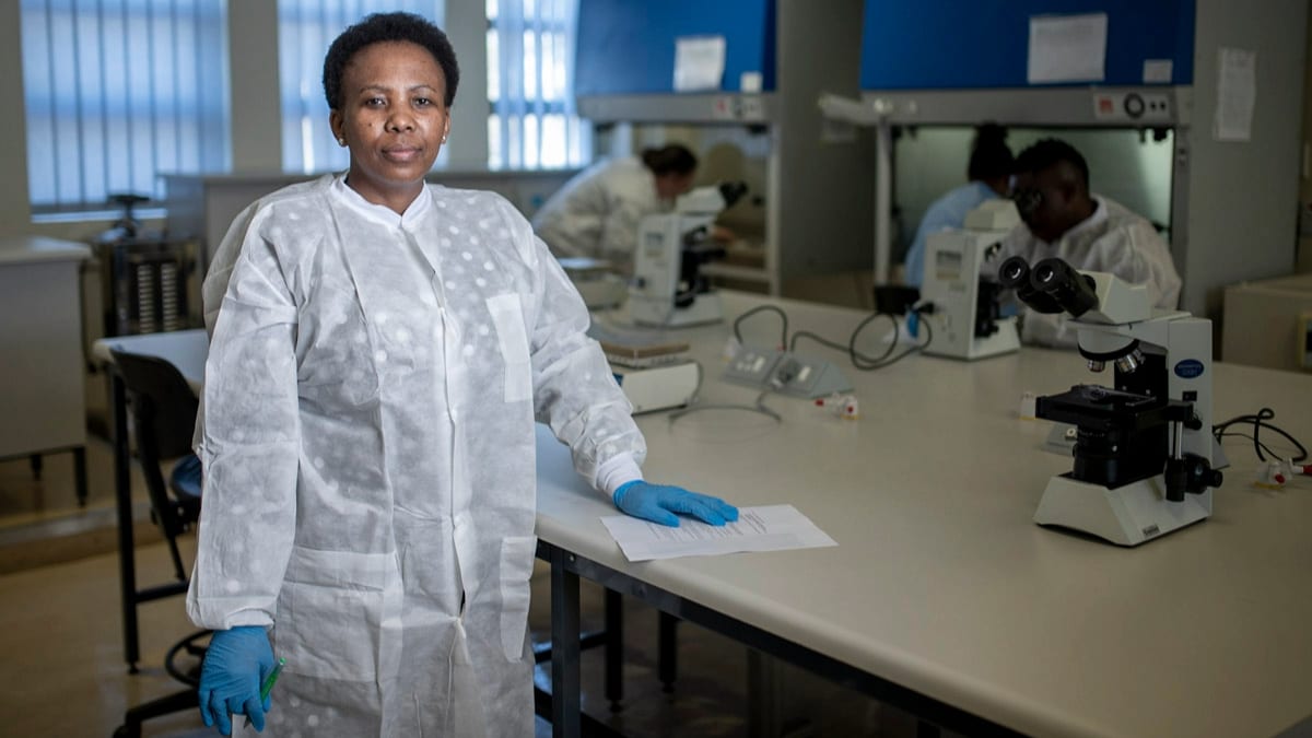 Woman in a white lab coat.