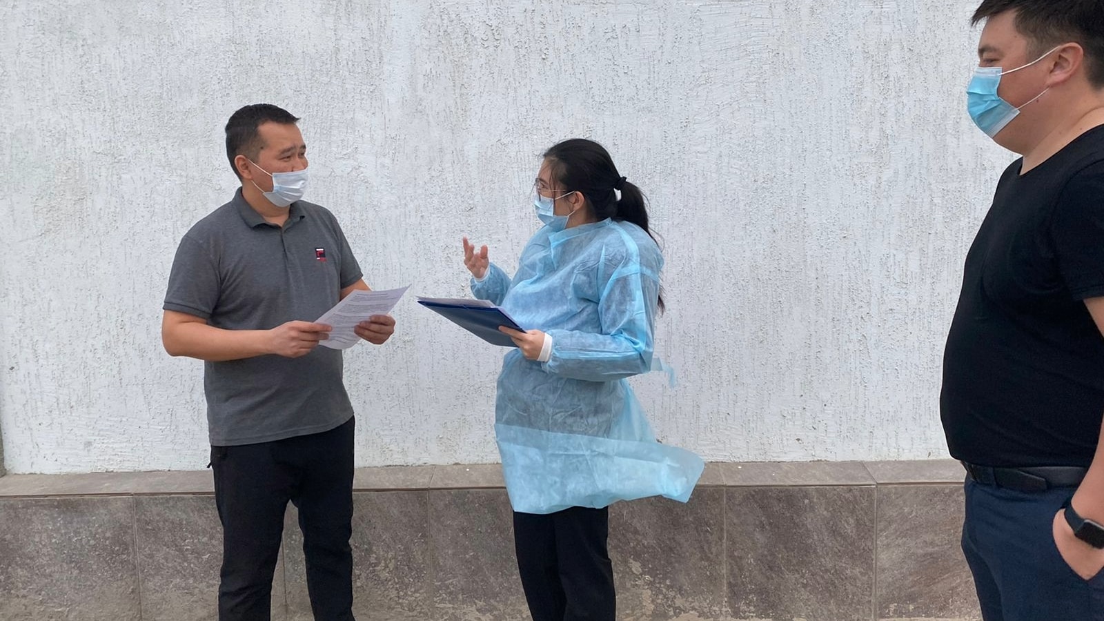 Dr. Taubayeva interviews a worker from a control group