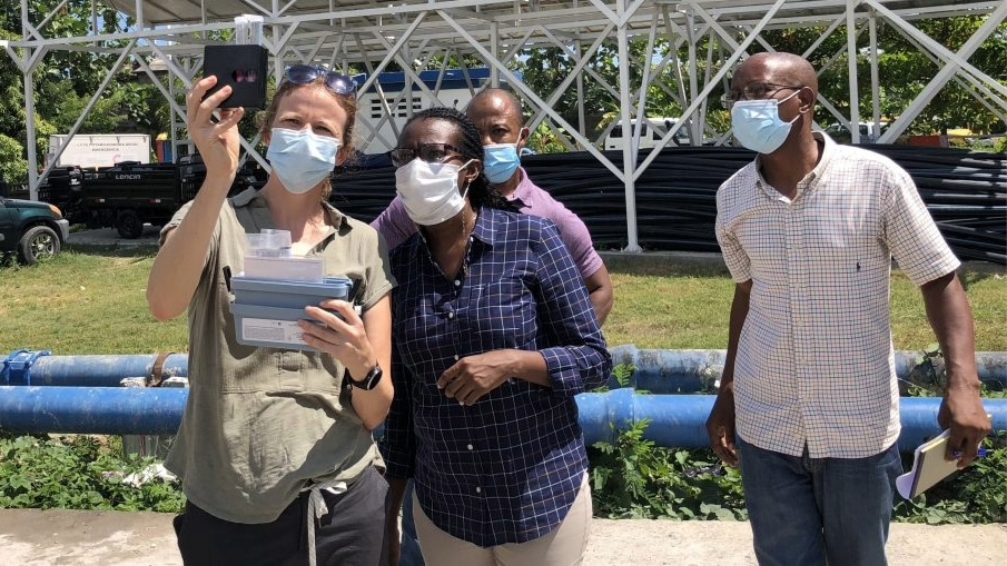 testing for free chlorine residual at the Haitian directorate for potable water and sanitation truck filling station