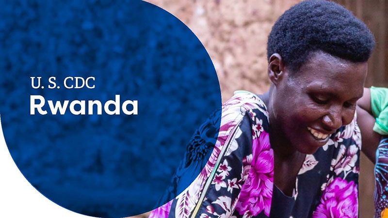 Smiling woman in Rwanda wearing a floral dress, featured in U.S. CDC Rwanda banner.