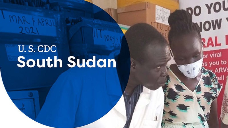 Healthcare worker and woman in a mask discuss supplies at a U.S. CDC South Sudan site.