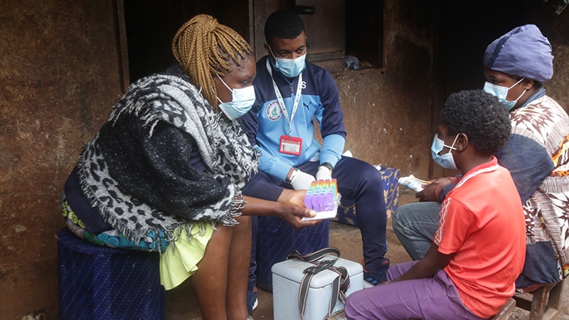 Photo of people living with HIV receiving care during worldwide public health emergency.