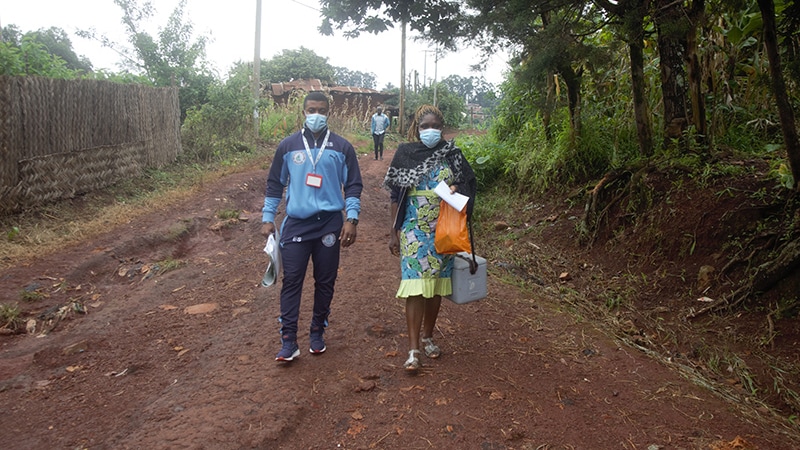 two individuals walking from HIV testing site