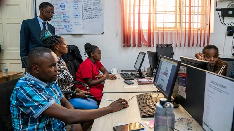 people on computer monitors