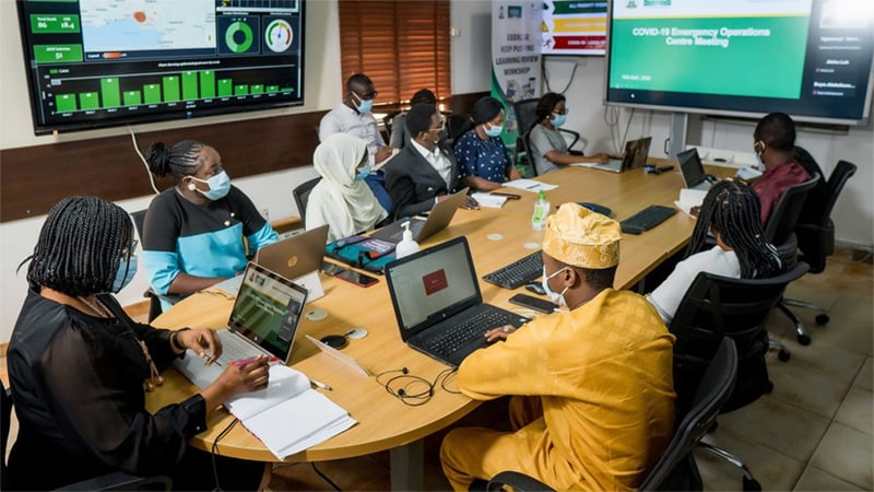 people meeting in emergency operations center