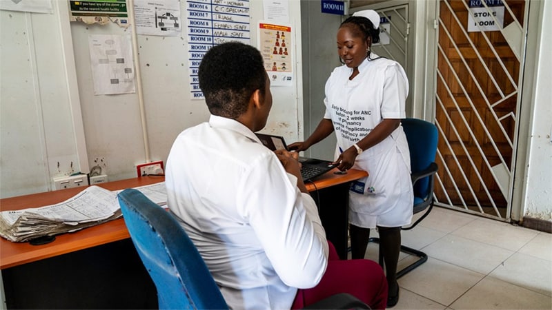 image of two health workers talking